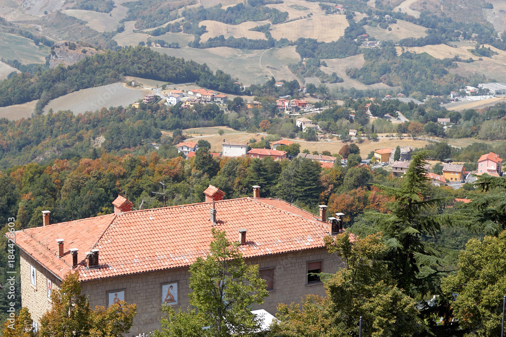 San marino, San Marino - July 10, 2017: View from the top of the view on houses with red roofs.