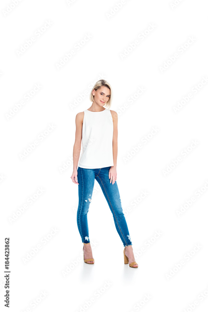 attractive blonde girl posing in jeans, isolated on white attractive blonde girl posing in jeans, isolated on white