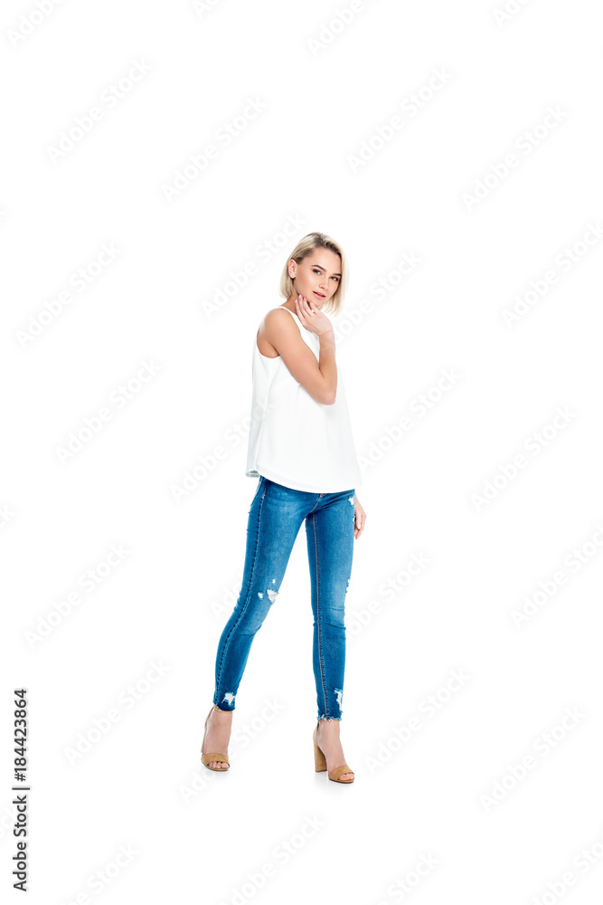 beautiful blonde girl posing in jeans, isolated on white beautiful blonde girl posing in jeans, isolated on white