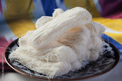 Eastern desserts.Pashmak is made from sugar,flour, butter. Uzbek sweets. photo