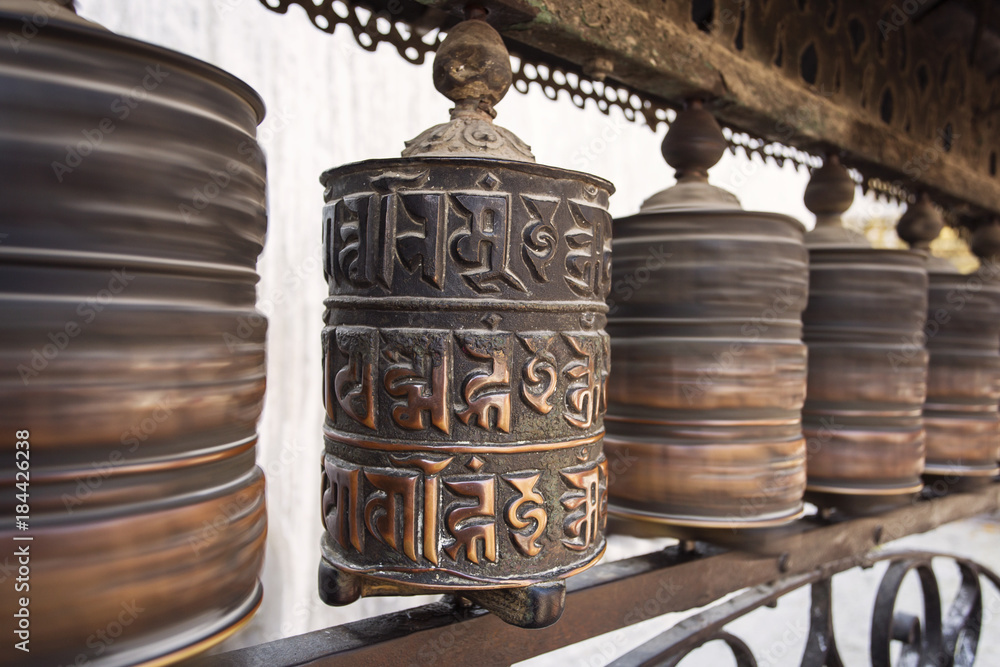 Prayer wheels made from metal at Swayambhunath Temple - Monkey Temple, Kathmandu, Nepal Prayer wheels made from metal at Swayambhunath Temple - Monkey Temple, Kathmandu, Nepal