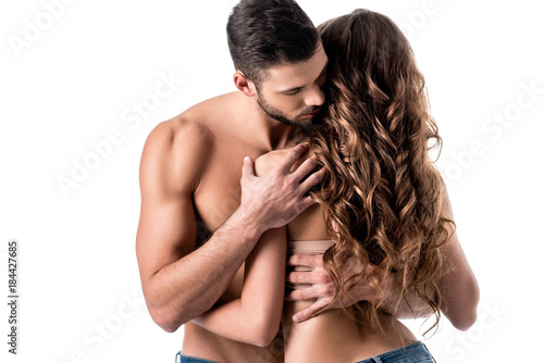 back view of beautiful sensual half naked couple in jeans isolated on white