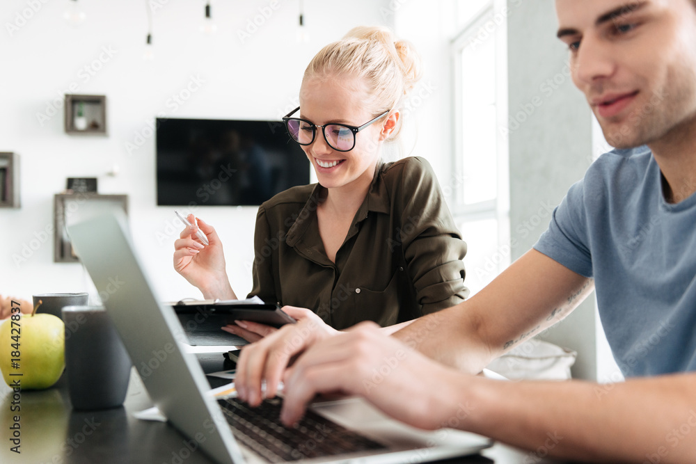Young busy couple working at home Young busy couple working at home