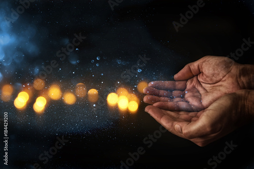 closeup hands of man begging for help. concept for poverty or hunger, seeking for light in the dark. photo