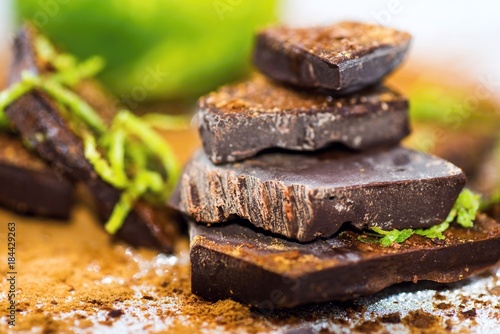 Broken pieces of chocolate with lime and cinnamon.