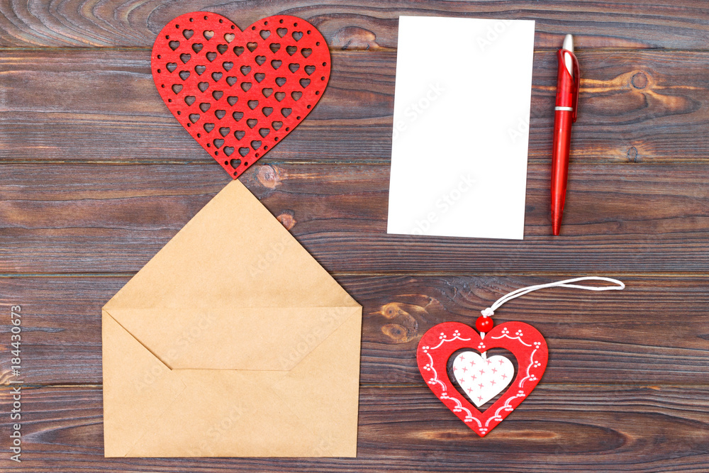 Flat lay. Top view. love letter on Saint Valentines Day. Handmade postcard with red heart shaped figure. Valentine day concept with copyspace Flat lay. Top view. love letter on Saint Valentines Day. Handmade postcard with red heart shaped figure. Valentine day concept with copyspace