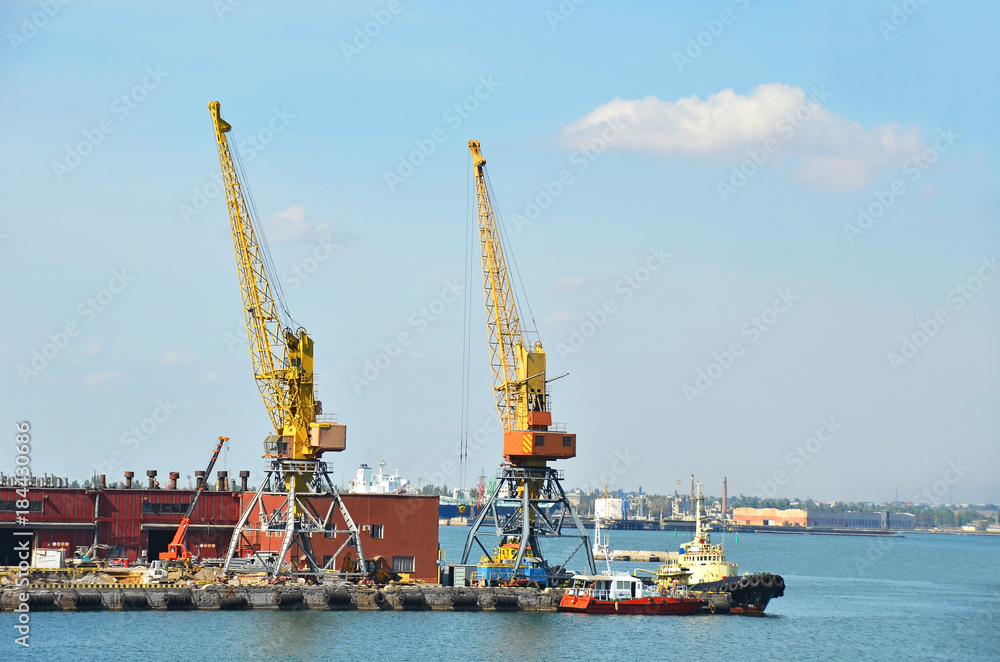 Tugboat and port cargo crane Tugboat and port cargo crane