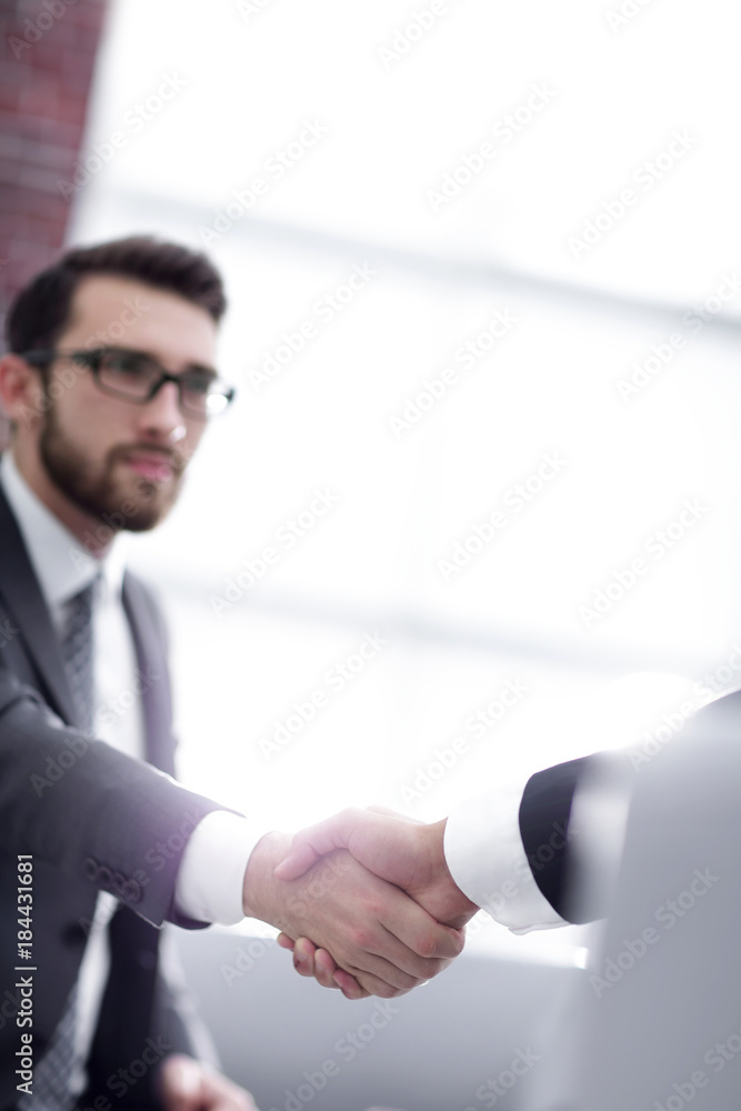 businessman shaking hands in office