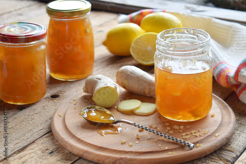 Homemade ginger and lemon jam on wooden background. Natural products to support the immune system in winter. Herbal medicine, healthy food.