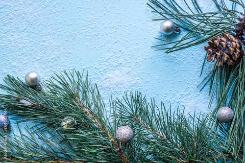 Christmas decoration. Branch christmas tree and cones spruce on snow. Top view, flat lay