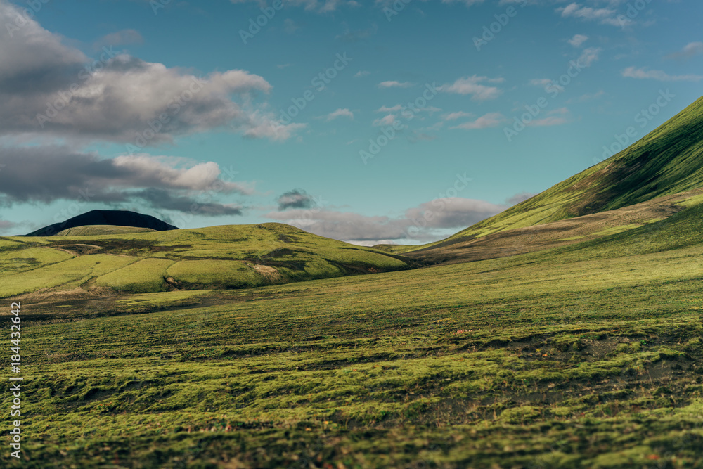 beautiful scenic landscape with green hills in Iceland