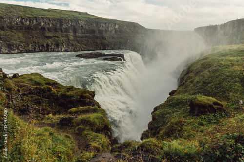 beautiful scenic icelandic landscape with majestic waterfall