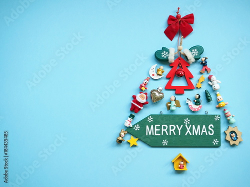 Group of Christmas decoration on blue wooden background. Christmas fir tree. photo