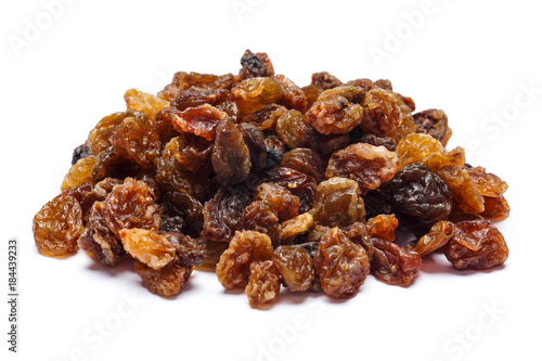 Heap of raisins on white background