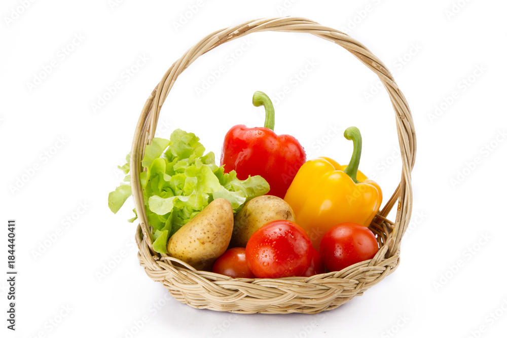 Assortment of fresh vegetables in basket isolated white background, grocery and supermarket product concept Assortment of fresh vegetables in basket isolated white background, grocery and supermarket product concept