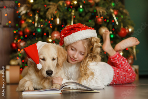 Girl with golden retriever, christmas photo