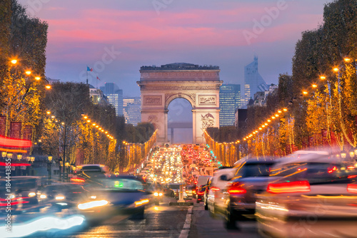 Famous Champs-Elysees and Arc de Triomphe at twilight in Paris © f11photo