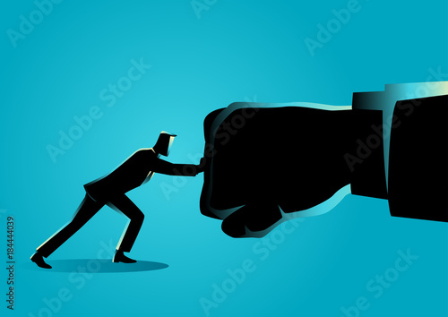 Businessman holding a giant punch