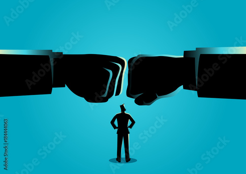 Businessman watching two giant fist clashed