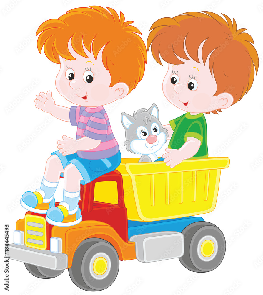 Little boys playing with a big toy truck and a small kitten Little boys playing with a big toy truck and a small kitten