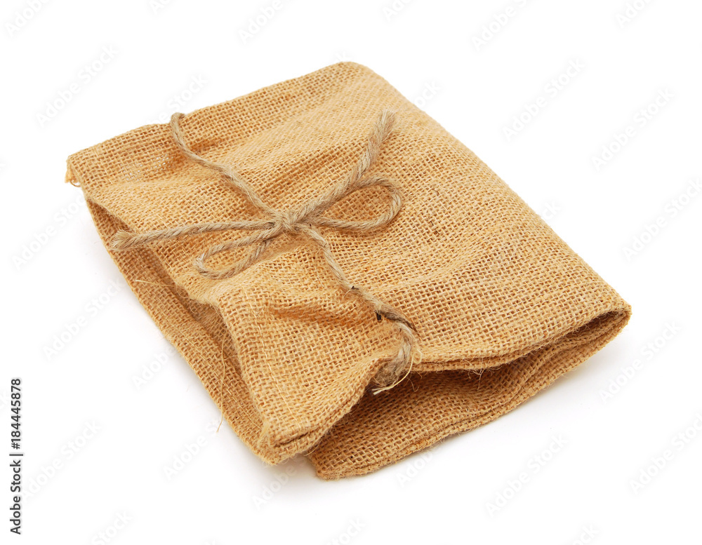 Hessian sack with ties forming over white background. Hessian sack with ties forming over white background.