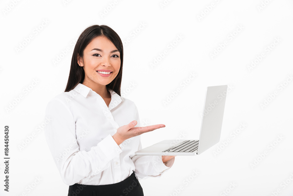 Portrait of a happy asian businesswoman holding laptop Portrait of a happy asian businesswoman holding laptop