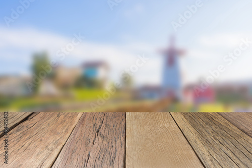 Empty wooden table top perspective with blurred background, used for montage or display your products