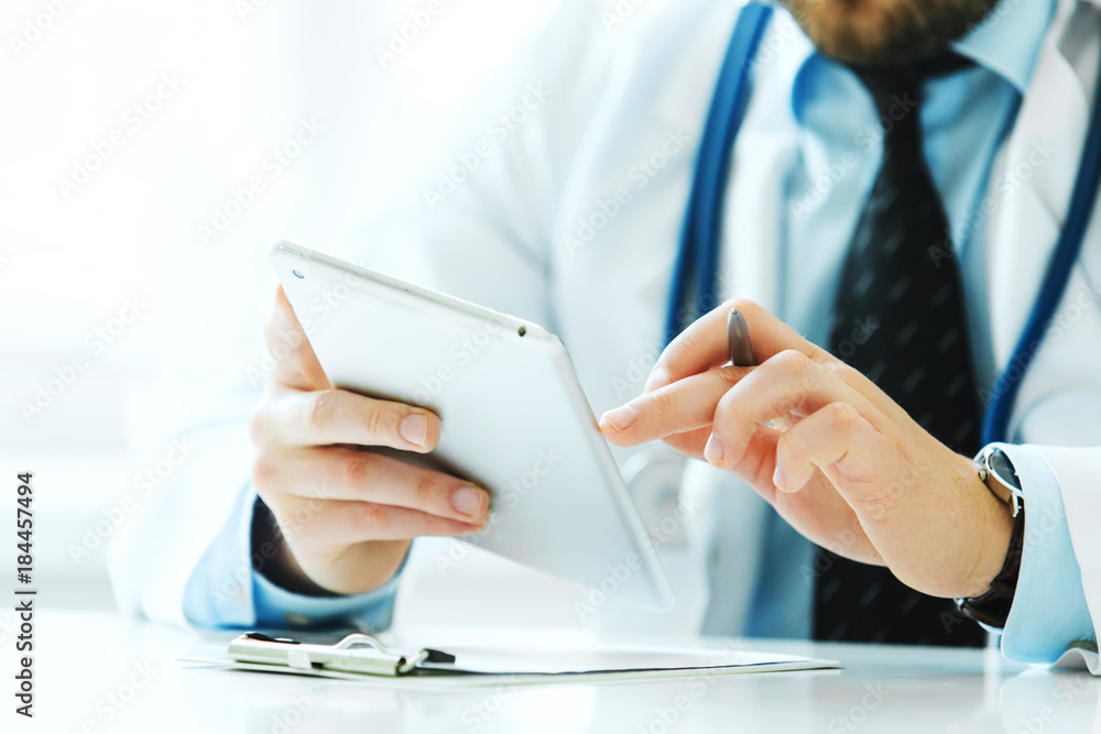 Close-up of doctor hand uses tablet Close-up of doctor hand uses tablet