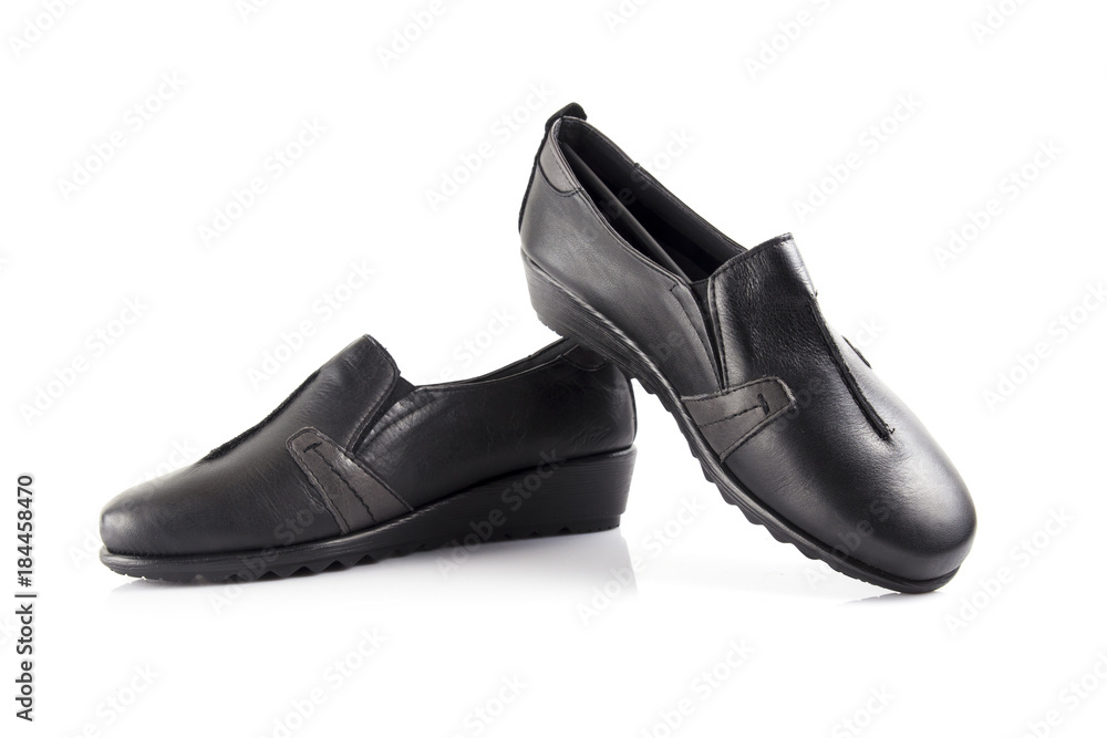 Female black leather shoe on white background, isolated product, comfortable footwear. Female black leather shoe on white background, isolated product, comfortable footwear.