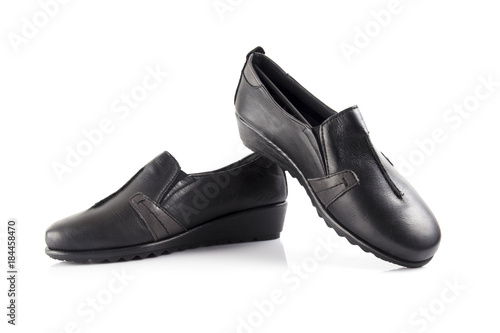 Female black leather shoe on white background, isolated product, comfortable footwear.