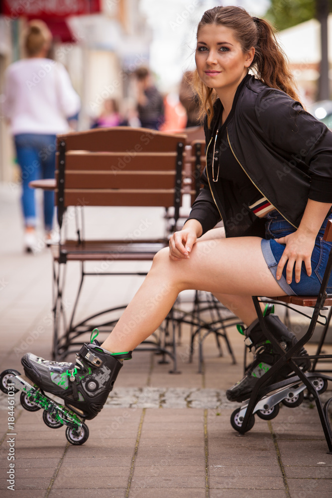 Young woman riding roller skates Young woman riding roller skates