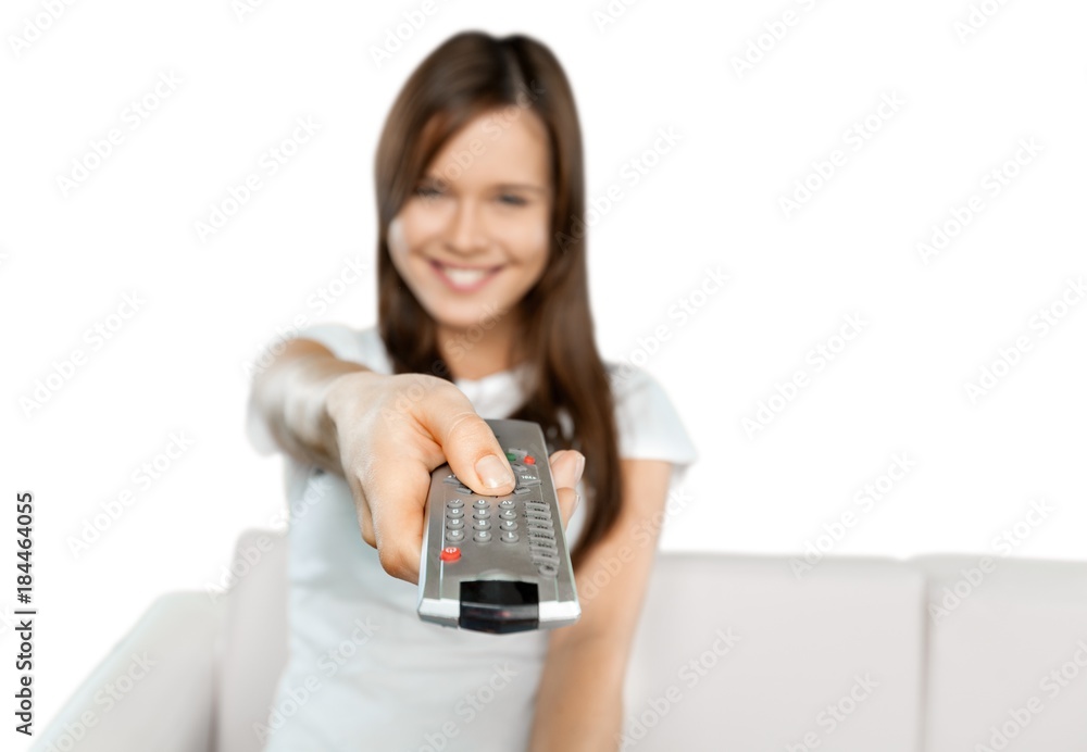 Smiling Woman Using a Remote Control