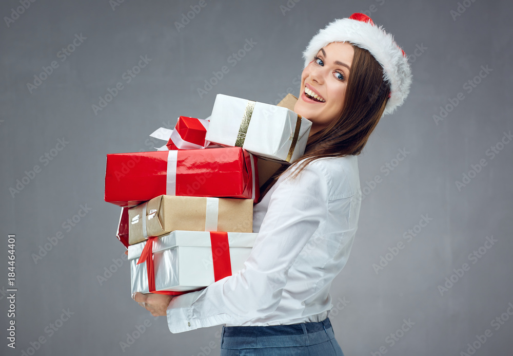 Santa businesswoman holding pile of christmas gifts. Santa businesswoman holding pile of christmas gifts.