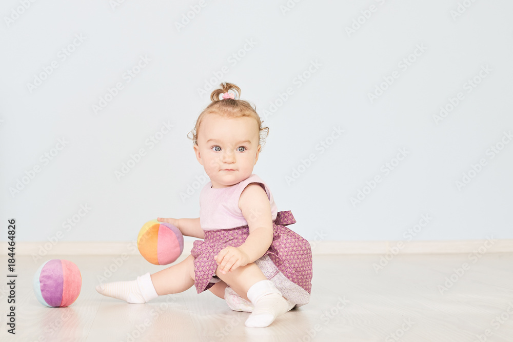 little child is playing with toys in the studio little child is playing with toys in the studio