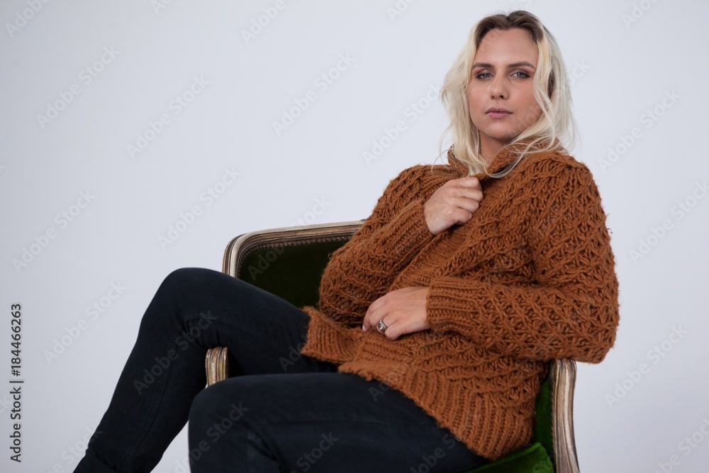 Transgender woman sitting on chair Transgender woman sitting on chair