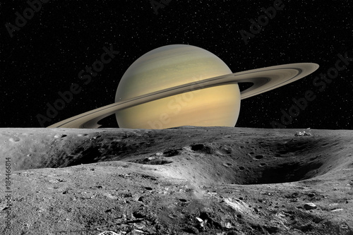 Fototapeta Naklejka Na Ścianę i Meble -  Planet Saturn from Saturn moon surface. Elements of this image furnished by NASA