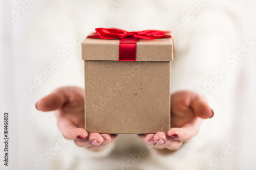 Present box in woman's hands