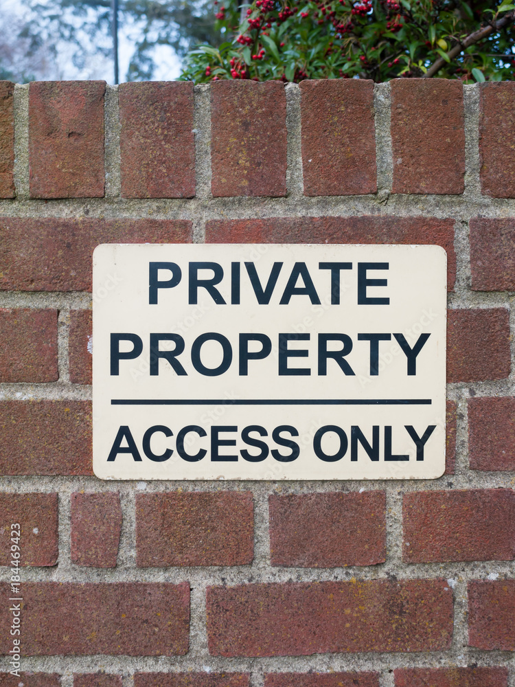 private property access only black and white sign on brick wall close up private property access only black and white sign on brick wall close up