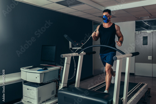 Obraz na płótnie Runner on treadmill at biomechanics lab