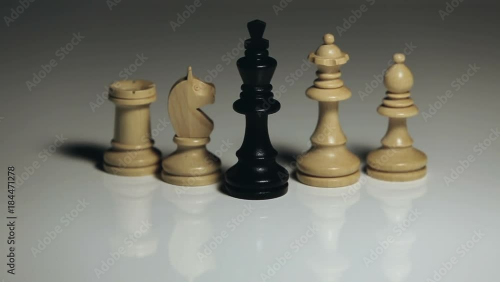 Chess Pieces: Black King Falling, White Rook, Officer, Queen, and Knight Standing Chess Pieces: Black King Falling, White Rook, Officer, Queen, and Knight Standing