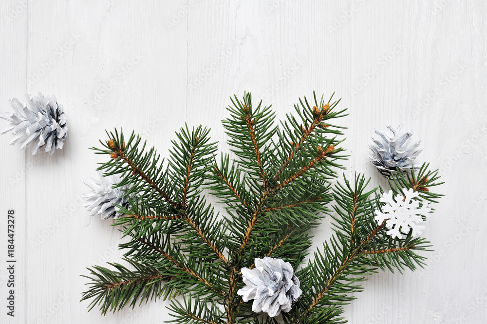 Mockup Christmas tree branch flatlay on a white wooden background, with place for your text