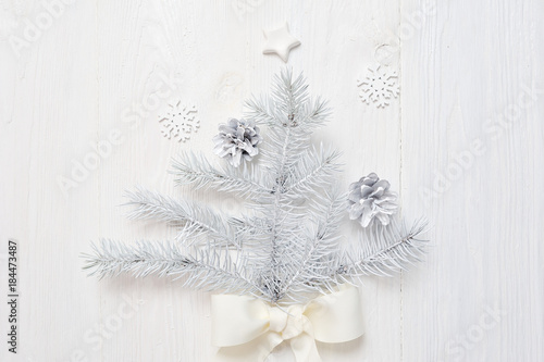 Mockup Christmas white tree and cone. Flatlay on a white wooden background, with place for your text