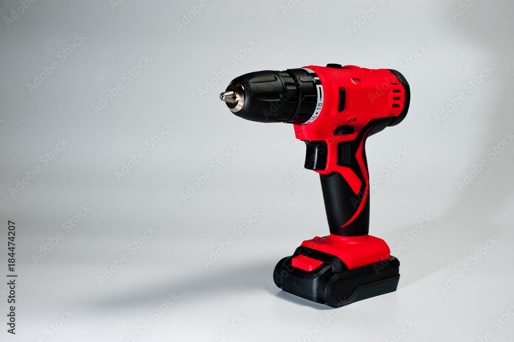 Screwdriver with rechargeable batteries, red, modern and reliable Screwdriver with rechargeable batteries, red, modern and reliable