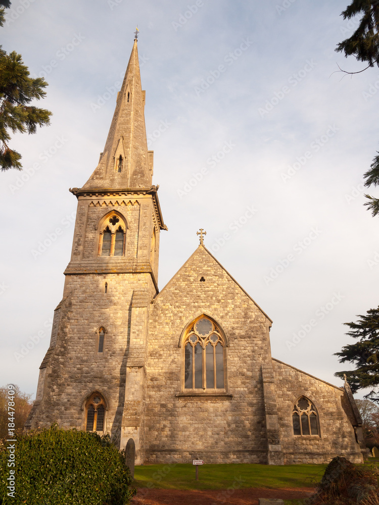 full frontal view of old stone christian english church in mistley