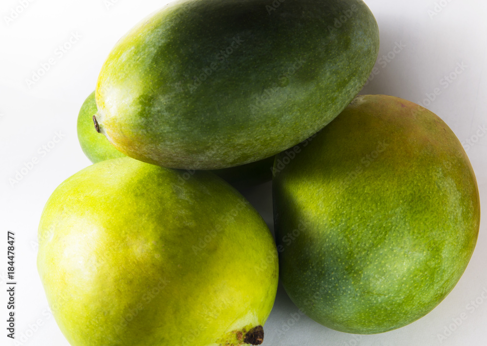Several mango fruits on white background Several mango fruits on white background