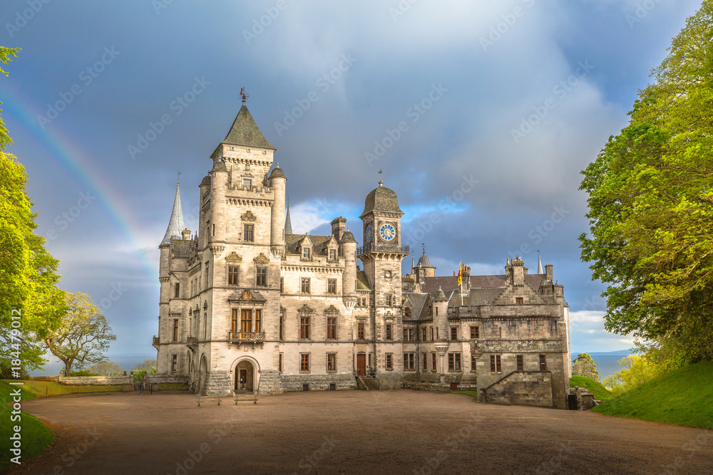 Spectacular rainbow in the dramatic sky at the scenic Dunrobin Castle in Scotland. Northern Highlands in Golspie, the east coast of Scotland, United Kingdom.
