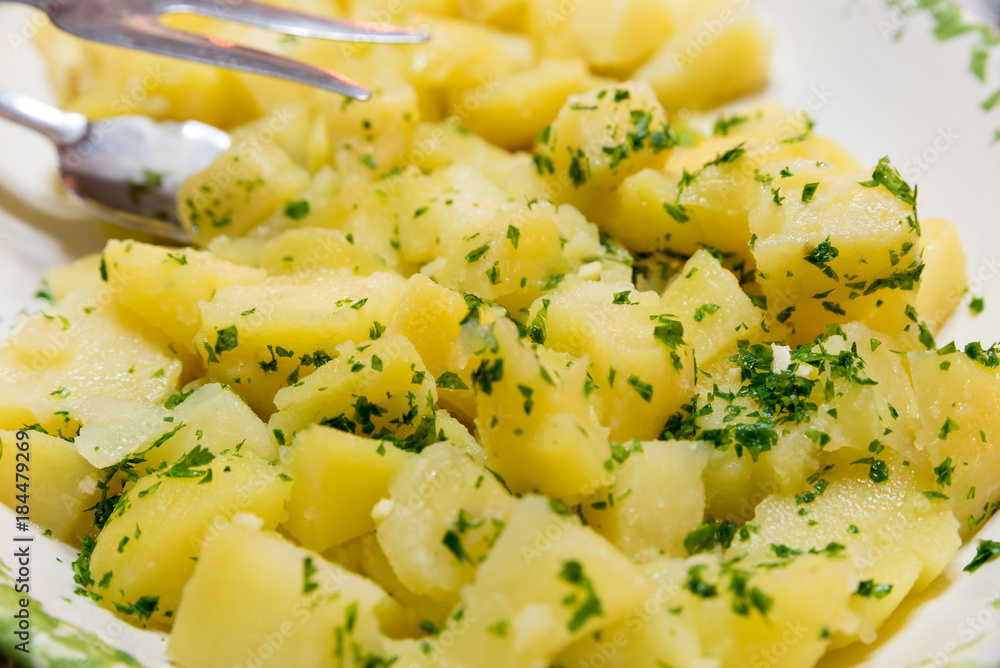 Side dish of boiled potatoes with parsley Side dish of boiled potatoes with parsley