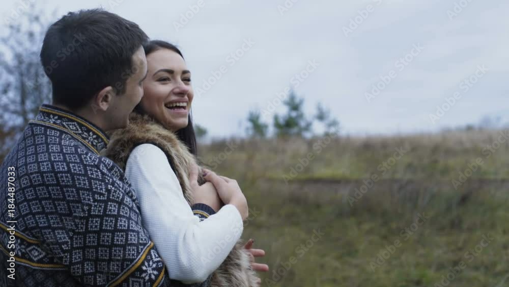 Lovely man kisses softly his girl on nature. 4K Lovely man kisses softly his girl on nature. 4K