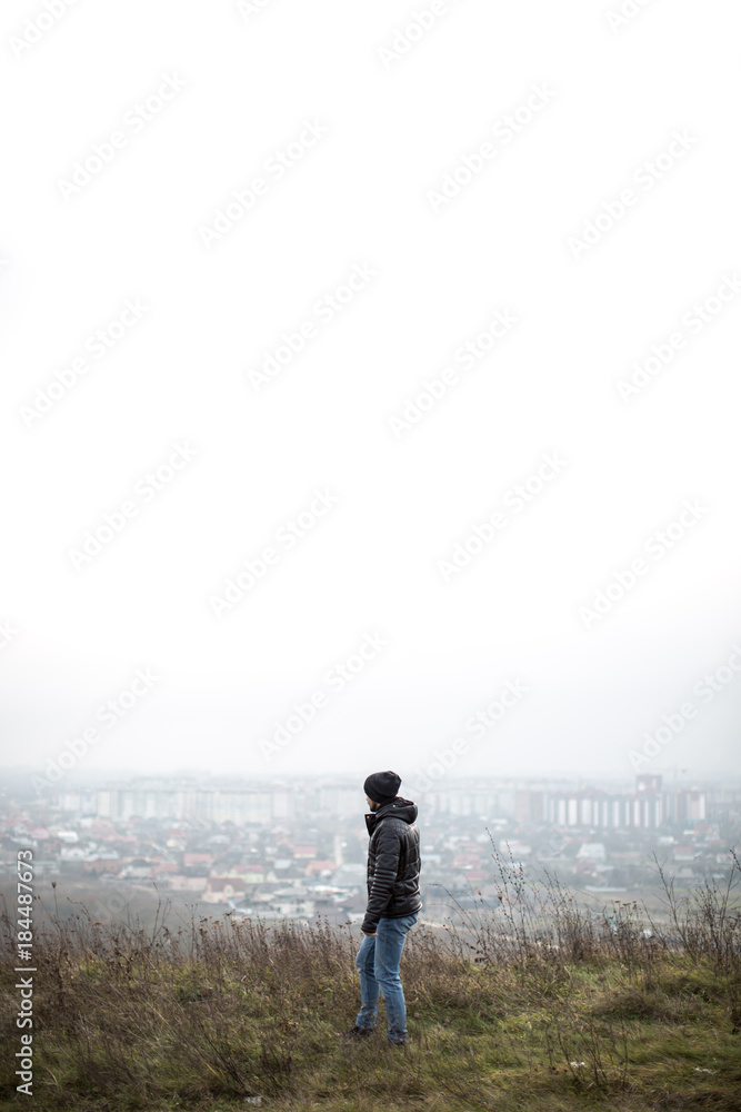 Man looking on the city from the mounten