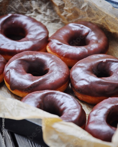 On a tray a portion of homemade donuts, a photo outdoors outside the house